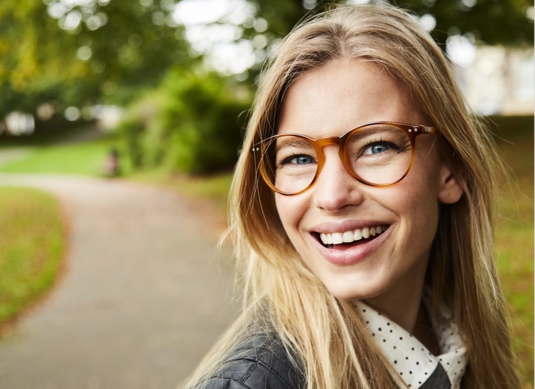 Woman Smiling With Glasses