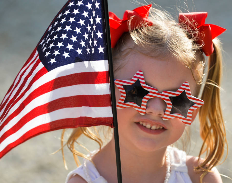 child holding USA flag
