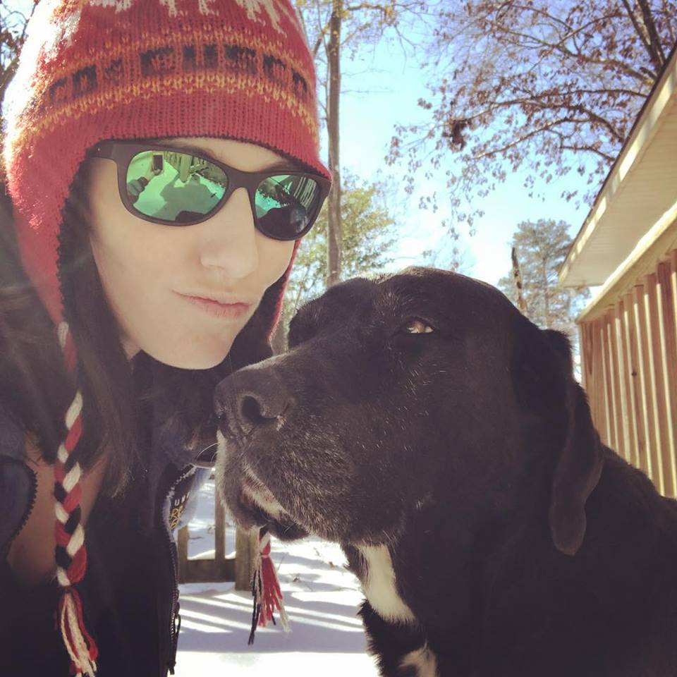 Woman and dog on snow day