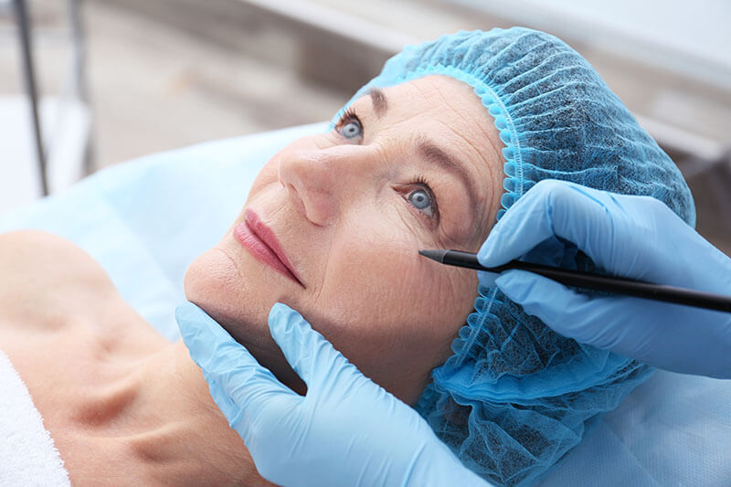 Woman Being Prepped for Cosmetic Surgery